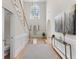Bright entryway with soaring ceilings, grand staircase, and elegant chandelier at 644 Stoneboro Ct, Charleston, SC 29412
