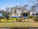 Well-maintained yellow house with a big backyard and wooden fence at 644 Stoneboro Ct, Charleston, SC 29412