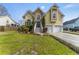 Charming two-story home featuring a well-manicured lawn, two-car garage, and inviting front entrance with mature trees at 644 Stoneboro Ct, Charleston, SC 29412