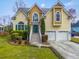 Inviting front exterior showcasing a green door, and manicured landscaping at 644 Stoneboro Ct, Charleston, SC 29412