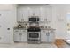Stylish kitchen features stainless steel appliances, sleek gray cabinets, and granite countertops at 644 Stoneboro Ct, Charleston, SC 29412