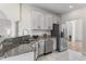 Bright kitchen features white cabinets, stainless appliances, granite countertops and recessed lighting at 644 Stoneboro Ct, Charleston, SC 29412