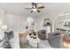 Open floor plan living room featuring natural light, fireplace, and access to kitchen and dining at 644 Stoneboro Ct, Charleston, SC 29412