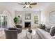 Inviting living room featuring a fireplace, ceiling fan, and neutral color palette at 644 Stoneboro Ct, Charleston, SC 29412
