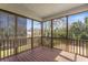 Covered porch with views of the backyard and natural surroundings at 644 Stoneboro Ct, Charleston, SC 29412