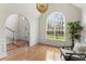 Sitting room with a large window, vaulted ceilings, and a modern chandelier at 644 Stoneboro Ct, Charleston, SC 29412