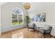 Sitting room with a large window, vaulted ceilings, and a modern chandelier at 644 Stoneboro Ct, Charleston, SC 29412