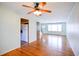 Inviting living room featuring hardwood floors, neutral walls, and a ceiling fan at 7 Doughty St # C, Charleston, SC 29403