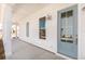 Charming front porch with a light blue door and white siding, offering a welcoming entrance to the home at 796 Clay Field Trl, Summerville, SC 29485