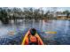 Scenic view of kayakers paddling on a calm lake surrounded by trees, seen from the perspective of a kayaker at 798 Clay Field Trl, Summerville, SC 29485