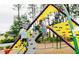 Community playground where children play on climbing structures amidst a wooded setting at 798 Clay Field Trl, Summerville, SC 29485