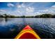Calm lake view from a kayak, showcasing serene waters and a cloudy sky at 798 Clay Field Trl, Summerville, SC 29485