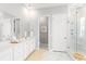 A bright bathroom with a double vanity, marble floors, and a seamless glass shower door at 800 Clay Field Trl, Summerville, SC 29485
