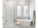 A bright bathroom with a seamless glass shower, soaking tub and modern fixtures at 800 Clay Field Trl, Summerville, SC 29485