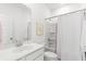 A well-lit bathroom with a single vanity, shower-tub combo, and charming decor at 800 Clay Field Trl, Summerville, SC 29485