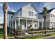 Charming two-story home with a welcoming front porch, manicured landscaping, and a picket fence at 800 Clay Field Trl, Summerville, SC 29485