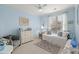 Bedroom with ceiling fan, large window, and daybed at 8661 Refuge Point Cir, North Charleston, SC 29420