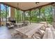 Gazebo interior with a fireplace, ceiling fans, picnic tables, and several chairs for outdoor relaxation and entertainment at 8661 Refuge Point Cir, North Charleston, SC 29420