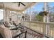 Relaxing screened porch with comfortable seating and ceiling fan, perfect for enjoying the outdoors at 8661 Refuge Point Cir, North Charleston, SC 29420