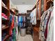 Spacious walk-in closet with custom shelves and hanging racks at 8661 Refuge Point Cir, North Charleston, SC 29420