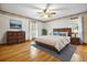 This bedroom features warm wood floors and detailed trim at 9030 Ethel Rd, North Charleston, SC 29406