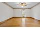 Bright bedroom with hardwood floors and a large window at 9030 Ethel Rd, North Charleston, SC 29406