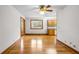 Hardwood floors and a ceiling fan in a dining room with views into the adjacent kitchen at 9030 Ethel Rd, North Charleston, SC 29406
