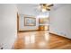 Sunlit dining area with hardwood floors offering a view into the well-equipped kitchen at 9030 Ethel Rd, North Charleston, SC 29406