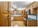 Charming kitchen with wood cabinets, skylight, and modern appliances at 9030 Ethel Rd, North Charleston, SC 29406