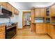 Well-equipped kitchen featuring wood cabinets, stainless steel appliances, and easy access to living spaces at 9030 Ethel Rd, North Charleston, SC 29406