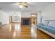 Bright living room features a brick fireplace, hardwood floors, and abundant natural light at 9030 Ethel Rd, North Charleston, SC 29406