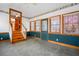 This sunroom entrance is finished with beautiful wainscoting, tile flooring and ample natural light at 9030 Ethel Rd, North Charleston, SC 29406