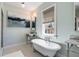 Elegant bathroom with a classic clawfoot tub, marble countertops and decorative wall art at 92 Bogard St, Charleston, SC 29403