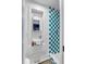 Compact bathroom with a modern sink, a checkered shower, and elegant finishes at 92 Bogard St, Charleston, SC 29403
