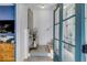 Bright foyer with stairs and glass door, featuring a zebra-themed table decor at 92 Bogard St, Charleston, SC 29403
