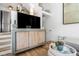 Living room featuring a large cabinet, decor, and hardwood floors at 92 Bogard St, Charleston, SC 29403
