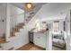 Cozy wet bar situated near staircase with stainless steel dishwasher at 92 Bogard St, Charleston, SC 29403