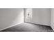 Cozy bedroom with plush gray carpeting and a bright window at 1018 Drakeford St # 8P, Saint George, SC 29477