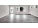 Bright living area featuring hardwood floors, ample natural light, and a welcoming atmosphere at 1018 Drakeford St # 8P, Saint George, SC 29477