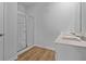 Bathroom showcasing dual sink vanity, walk-in shower and vinyl wood-look flooring at 1036 Forrest Creek Dr, Summerville, SC 29483