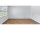 Bright bedroom with wood-look floors and natural light from a large window at 1036 Forrest Creek Dr, Summerville, SC 29483