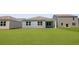 A light blue home with a gray roof sits on a green lawn near similar homes at 1036 Forrest Creek Dr, Summerville, SC 29483
