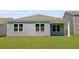 This home has pale blue siding, a gray roof, and a well-manicured lawn at 1036 Forrest Creek Dr, Summerville, SC 29483