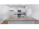 Bright kitchen with granite counters, white cabinets, island with double sink and modern appliances at 1036 Forrest Creek Dr, Summerville, SC 29483
