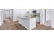 Open kitchen with island, granite countertops, white cabinetry, and stainless steel appliances at 1036 Forrest Creek Dr, Summerville, SC 29483