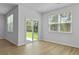 Living area featuring lots of natural light from windows and sliding door to back yard at 1036 Forrest Creek Dr, Summerville, SC 29483