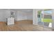 Bright living room with sliding glass doors and wood-look vinyl plank flooring throughout at 1036 Forrest Creek Dr, Summerville, SC 29483