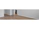 Open floor plan with sight lines into the kitchen and vinyl wood-look flooring at 1036 Forrest Creek Dr, Summerville, SC 29483