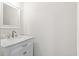 Elegant powder room features a white vanity with marble countertop and a classic framed mirror at 104 Broadmarsh Ct, North Charleston, SC 29418