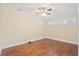 This bright, airy bedroom boasts hardwood floors, a ceiling fan and natural light from shuttered windows at 104 Broadmarsh Ct, North Charleston, SC 29418